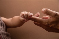 Baby reaching out to parent. Not Found